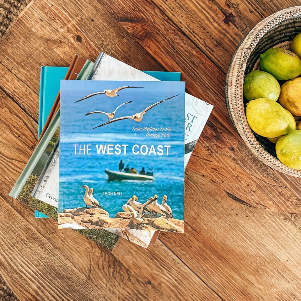 West Coast South Africa book shown in sustainable accommodation in Paternoster on the beach